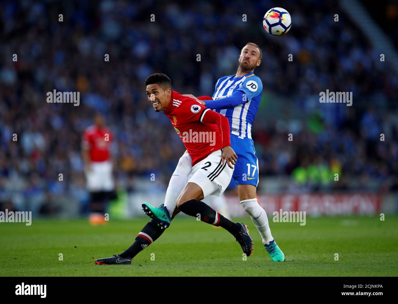 Soccer Football - Premier League - Brighton & Hove Albion v Manchester United - The American Express Community Stadium, Brighton, Britain - May 4, 2018   Manchester United's Chris Smalling in action with Brighton's Glenn Murray    REUTERS/Eddie Keogh    EDITORIAL USE ONLY. No use with unauthorized audio, video, data, fixture lists, club/league logos or 'live' services. Online in-match use limited to 75 images, no video emulation. No use in betting, games or single club/league/player publications.  Please contact your account representative for further details.     TPX IMAGES OF THE DAY Stock Photo
