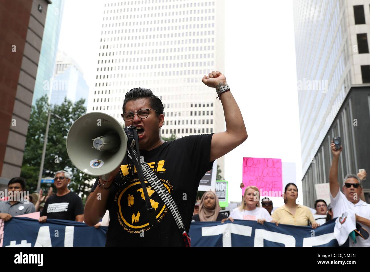 Cesar Espinosa, a leader in local activism, leads demonstrators protesting the Trump administration's immigration policies as part of a 'Families Belong Together' rally in Houston, Texas, U.S., June 30, 2018.  REUTERS/Loren Elliott Stock Photo