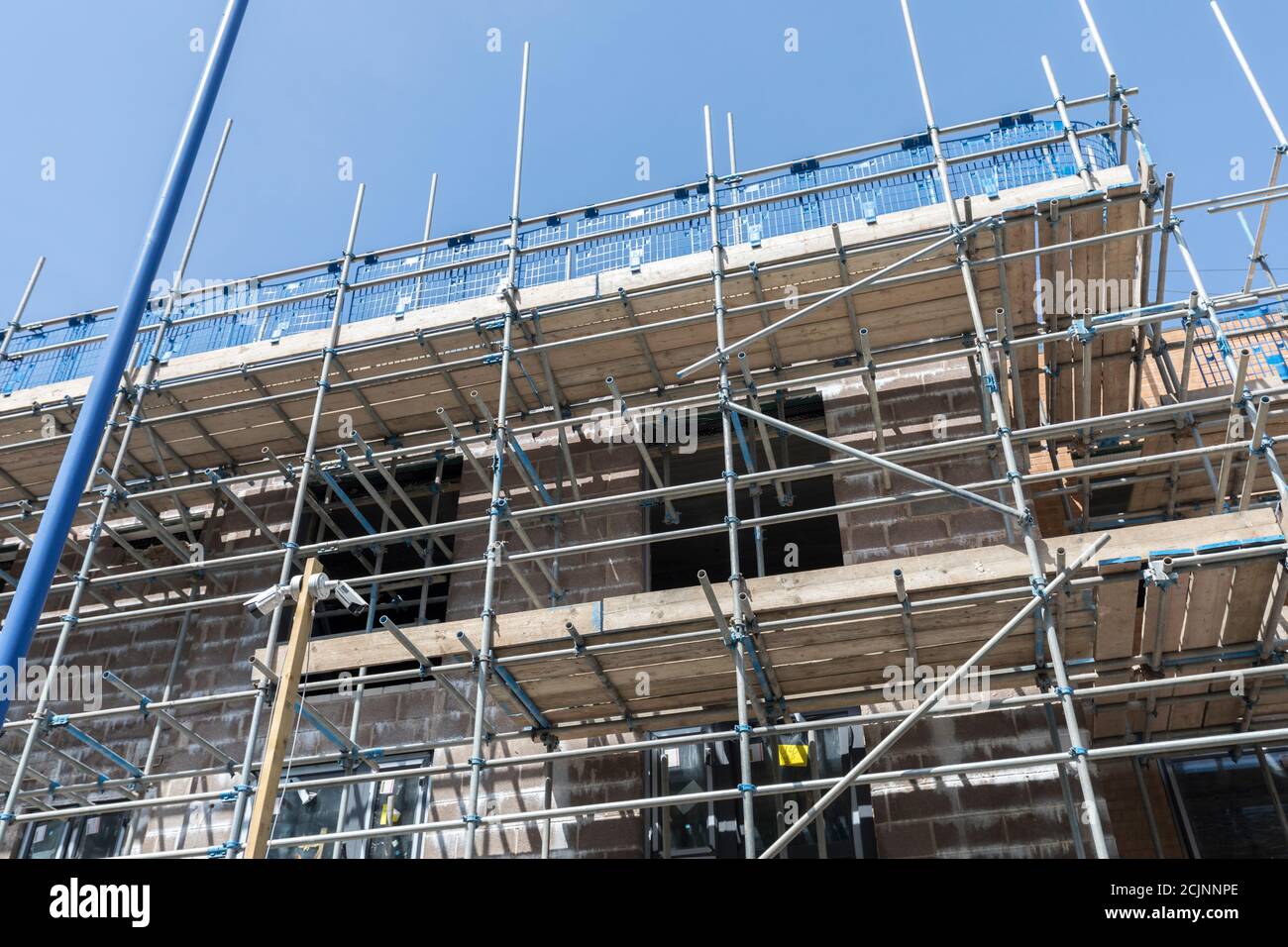 Scaffolding and safety railing on new build in Abergavenny, Wales, UK