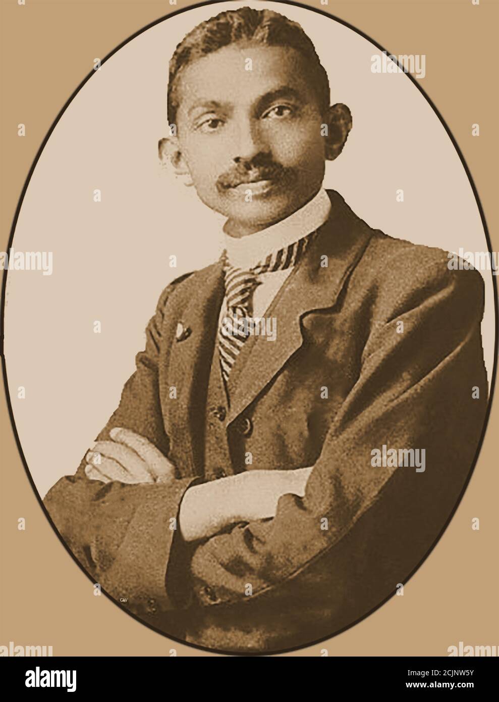 A  portrait of a young Mahatma Gandhi (aged 37) -- Mohandas Karamchand Gandhi (1869 – 1948) was an Indian lawyer, civil rights activist, anti-colonial nationalist, and political ethicist,  who  was famous for his nonviolent resistance in his  successful campaign for India's independence from British rule. Stock Photo