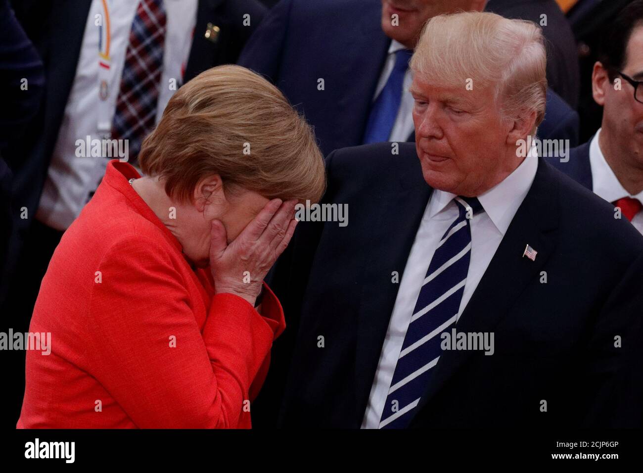 German Chancellor Angela Merkel reacts next to U.S. President Donald Trump during the G20 leaders summit in Hamburg, Germany July 7, 2017. REUTERS/Philippe Wojazer Stock Photo