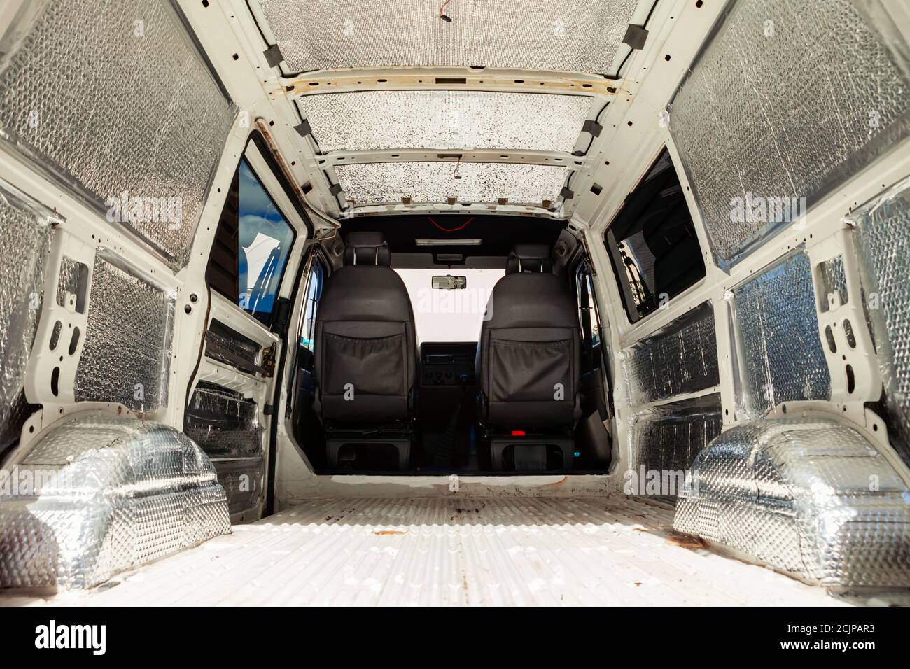 Conversion of a t4 van into a camper van.. Soundproofing and insulation  have been added to the van ready for carpeting Stock Photo - Alamy