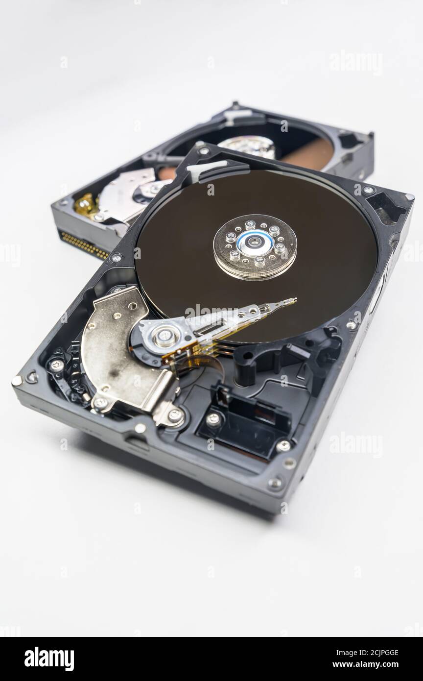 Old-fashioned, open, mechanical harddisc drive, isolated on a white background Stock Photo