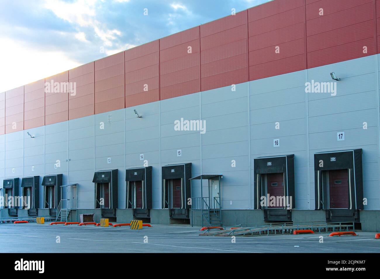 Warehouse complex outside with a gate for loading goods into the car. Stock Photo