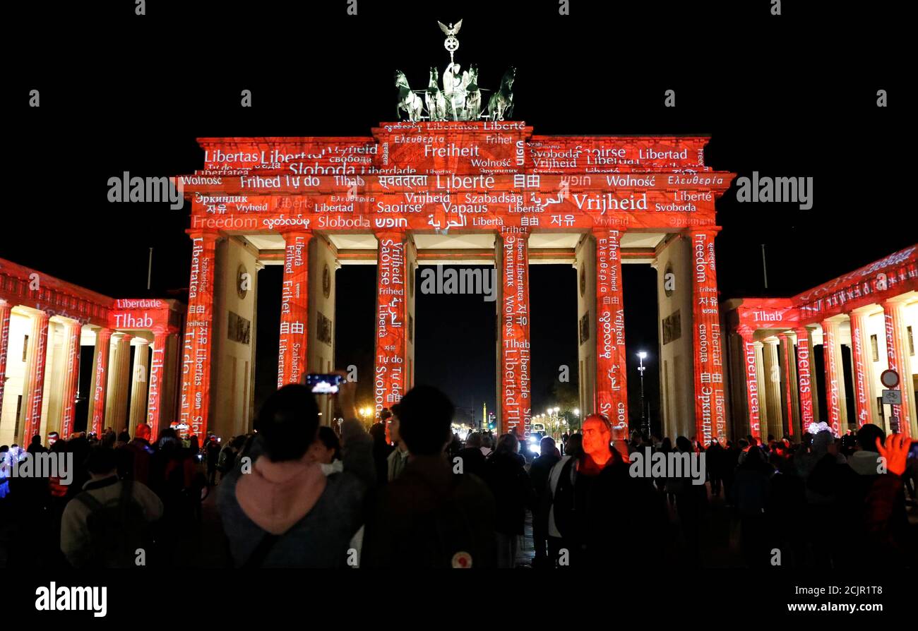 The Brandenburg Gate is pictured from the former East German site during  the Festival of Lights event at night in Berlin, Germany, October 16, 2019.  On November 9th Germany will mark the