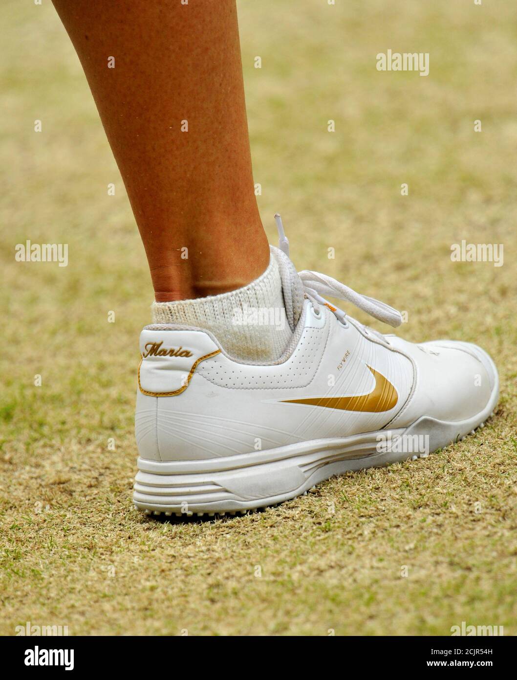 The shoe of Maria Sharapova of Russia is seen during her final match  against Petra Kvitova of the Czech Republic at the Wimbledon tennis  championships in London July 2, 2011. REUTERS/Toby Melville (