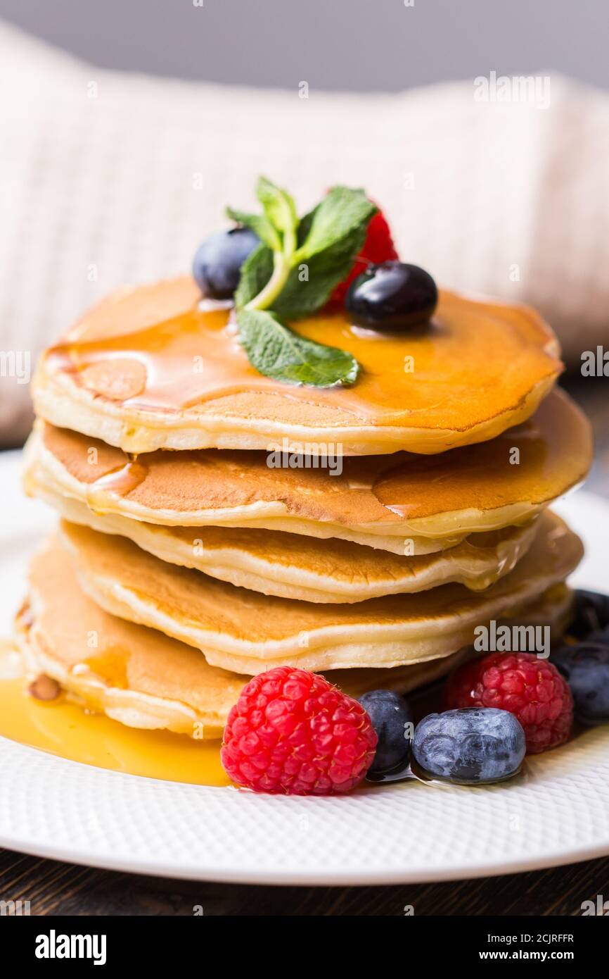 Pancakes Raspberry Blueberries Mint Pile of pancakes with blueberries and raspberries and maple syrup for ...