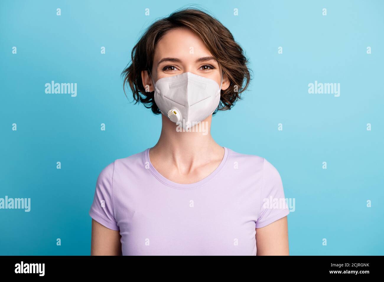 Close-up portrait of her she nice attractive brown-haired girl wearing safety reusable n95 mask flu flue grippe preventive measures stop pandemia Stock Photo