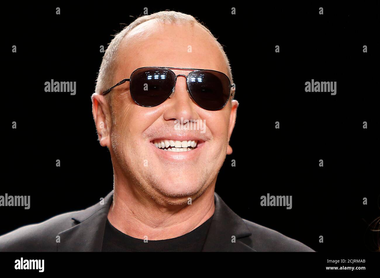 Designer Michael Kors stands on the runway before the Project Runway show at Fashion Week in New York, February 8, 2013.  REUTERS/Carlo Allegri  (UNITED STATES - Tags: ENTERTAINMENT PROFILE HEADSHOT FASHION) Stock Photo