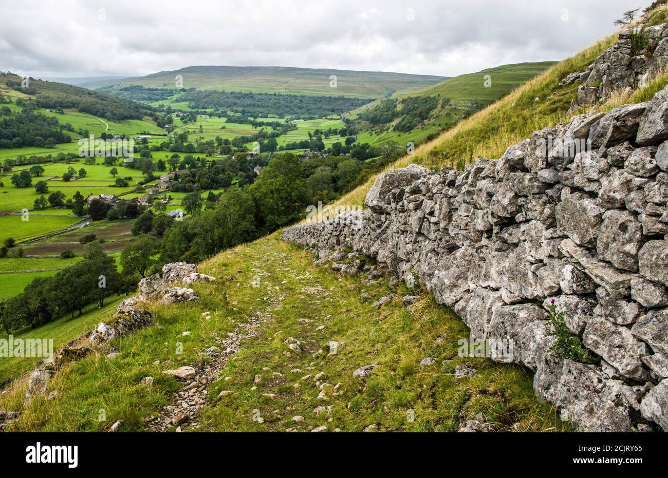 Looking up Upper Wharfedale from footpath walk connecting Buckden to Kettlewell and further up the dale. The vlllage below is Buckden Yorkshire  Dales Stock Photo