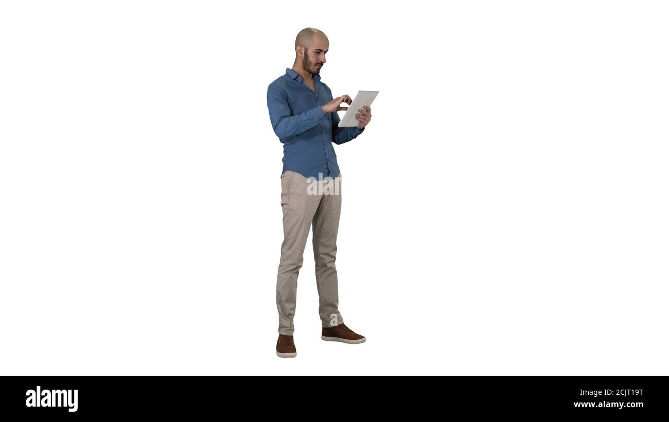 Handsome arabic business man using tablet on white background. Stock Photo