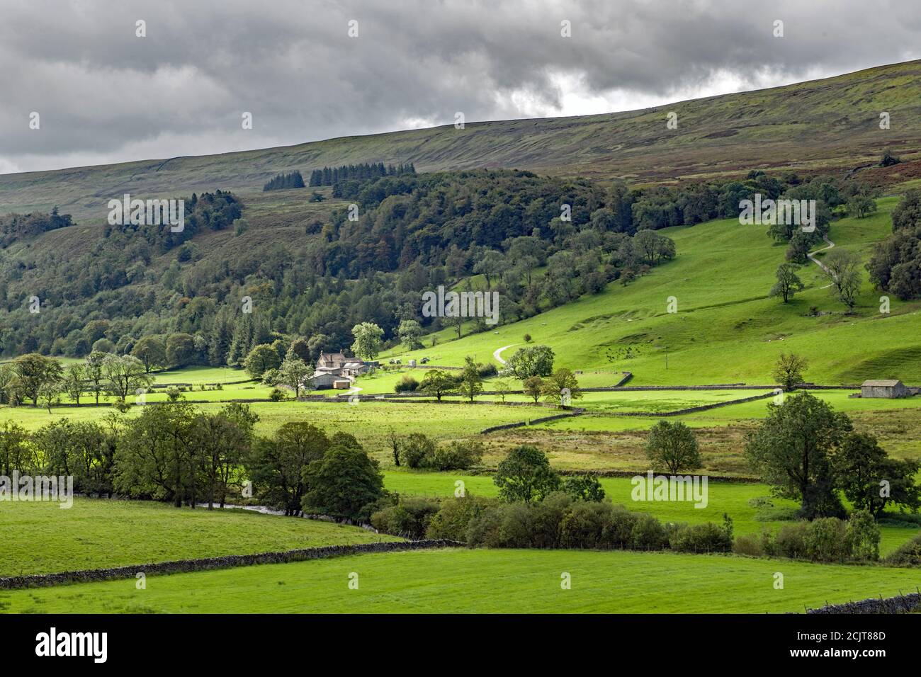 View down Lower Wharfedale from near Starbotton, with a puddle of light brightening up the valley. Stock Photo