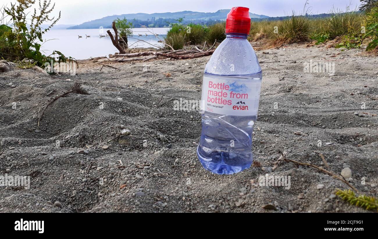 A discarded water bottle left by an idiot litter lout in Ambleside, Lake District, UK. Stock Photo