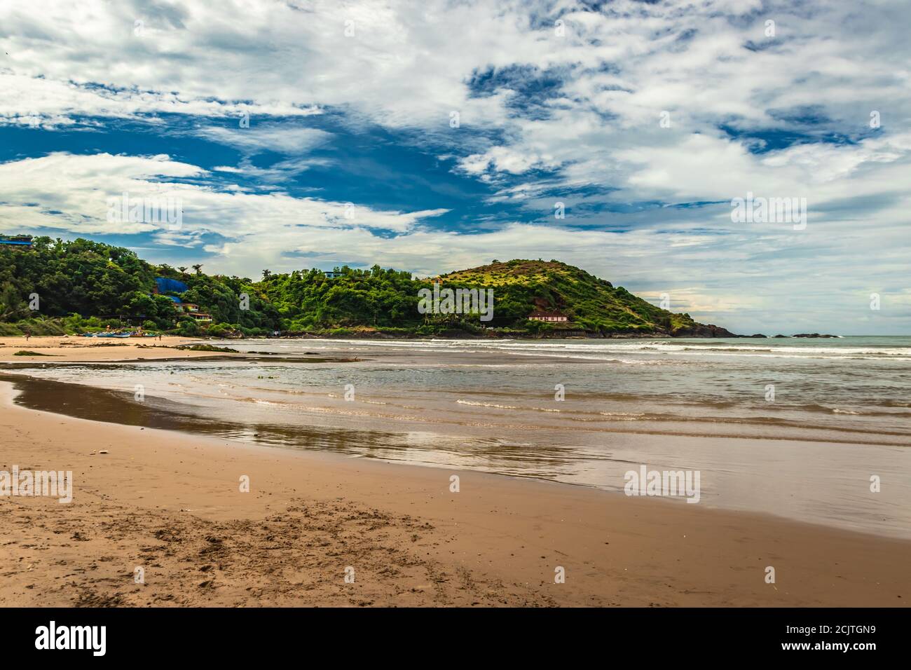 beach with mountain and amazing sky at morning from flat angle image is taken at gokarna beach karnataka india. it is one the best beach of gokarna. Stock Photo