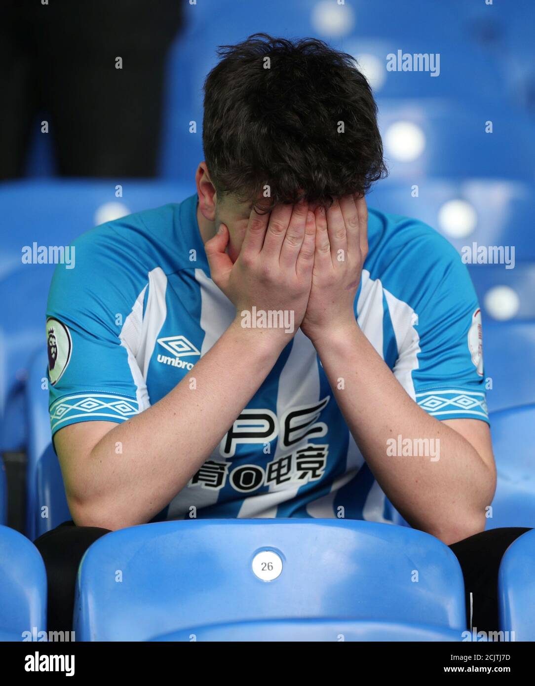 Soccer Football - Premier League - Crystal Palace v Huddersfield Town - Selhurst Park, London, Britain - March 30, 2019  A Huddersfield Town fan reacts after the match as they are relegated from the Premier League   REUTERS/Hannah McKay  EDITORIAL USE ONLY. No use with unauthorized audio, video, data, fixture lists, club/league logos or 'live' services. Online in-match use limited to 75 images, no video emulation. No use in betting, games or single club/league/player publications.  Please contact your account representative for further details. Stock Photo