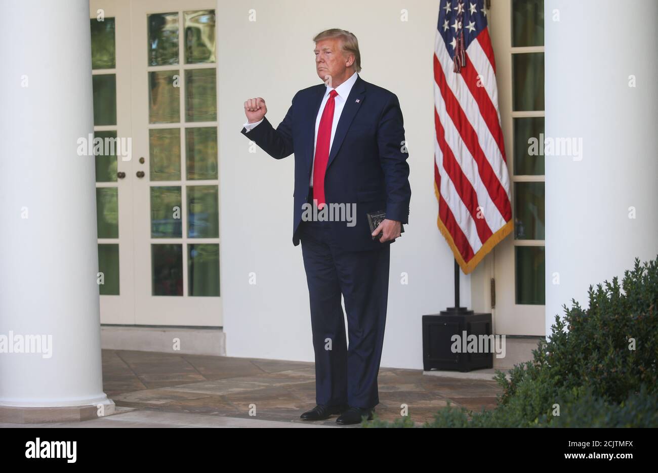 U.S. President Donald Trump makes a fist as he stands on the West Wing colonnade outside the Oval Office at an event to officially launch the United States Space Command in the Rose Garden of the White House in Washington, U.S., August 29, 2019. REUTERS/Leah Millis Stock Photo