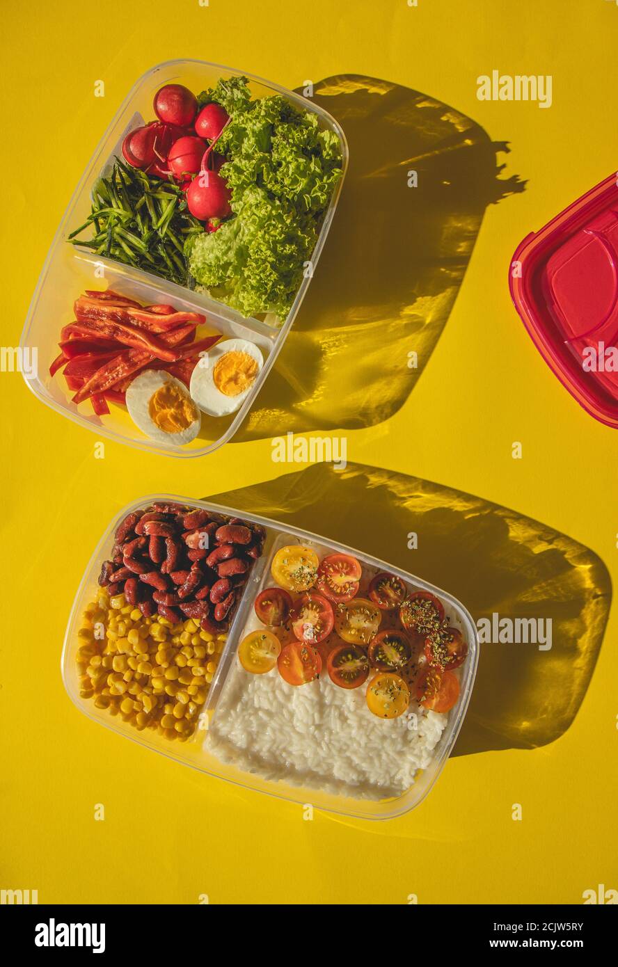 Homemade vegetarian food in lunch boxes with healthy vegetables