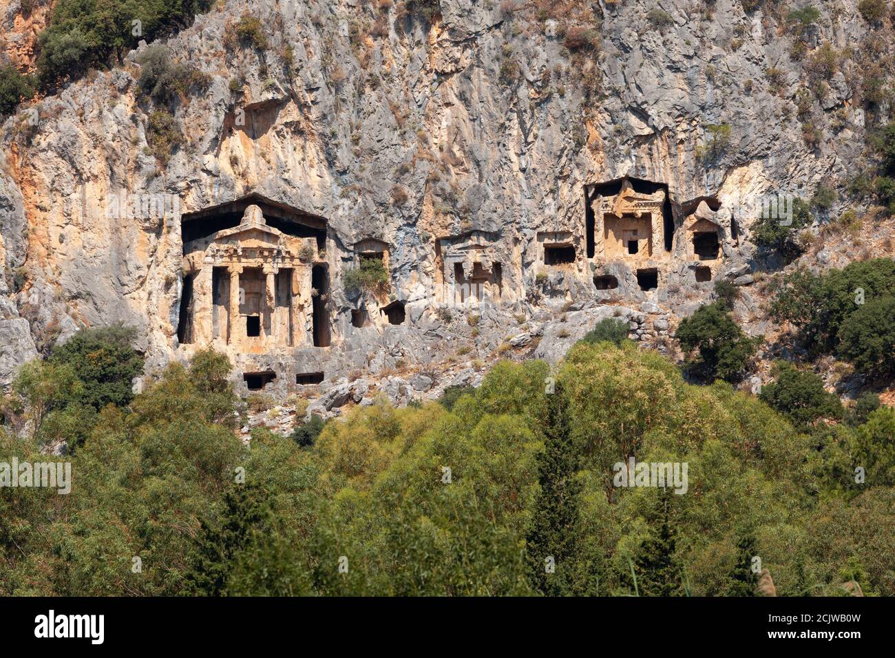 Lycian Royal mountain tombs carved into the rocks near the town of Dalyan in the province of Marmaris in Turkey Stock Photo