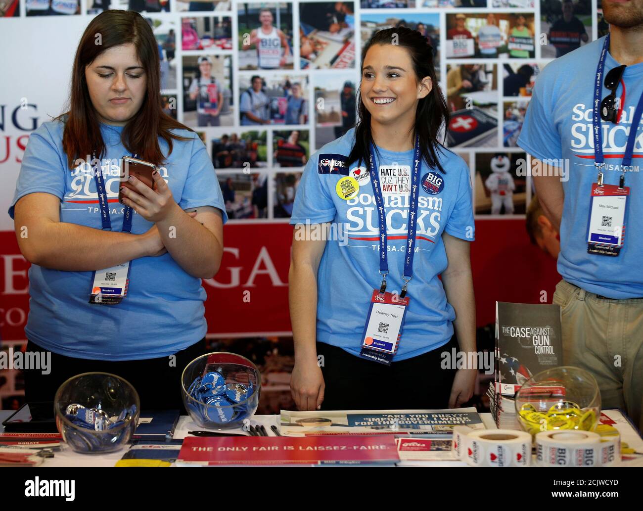 Volunteers at the Turning Point USA booth wait to speak with people attending the Conservative Political Action Conference (CPAC) in National Harbor, Maryland, U.S., February 23, 2017.      REUTERS/Joshua Roberts Stock Photo