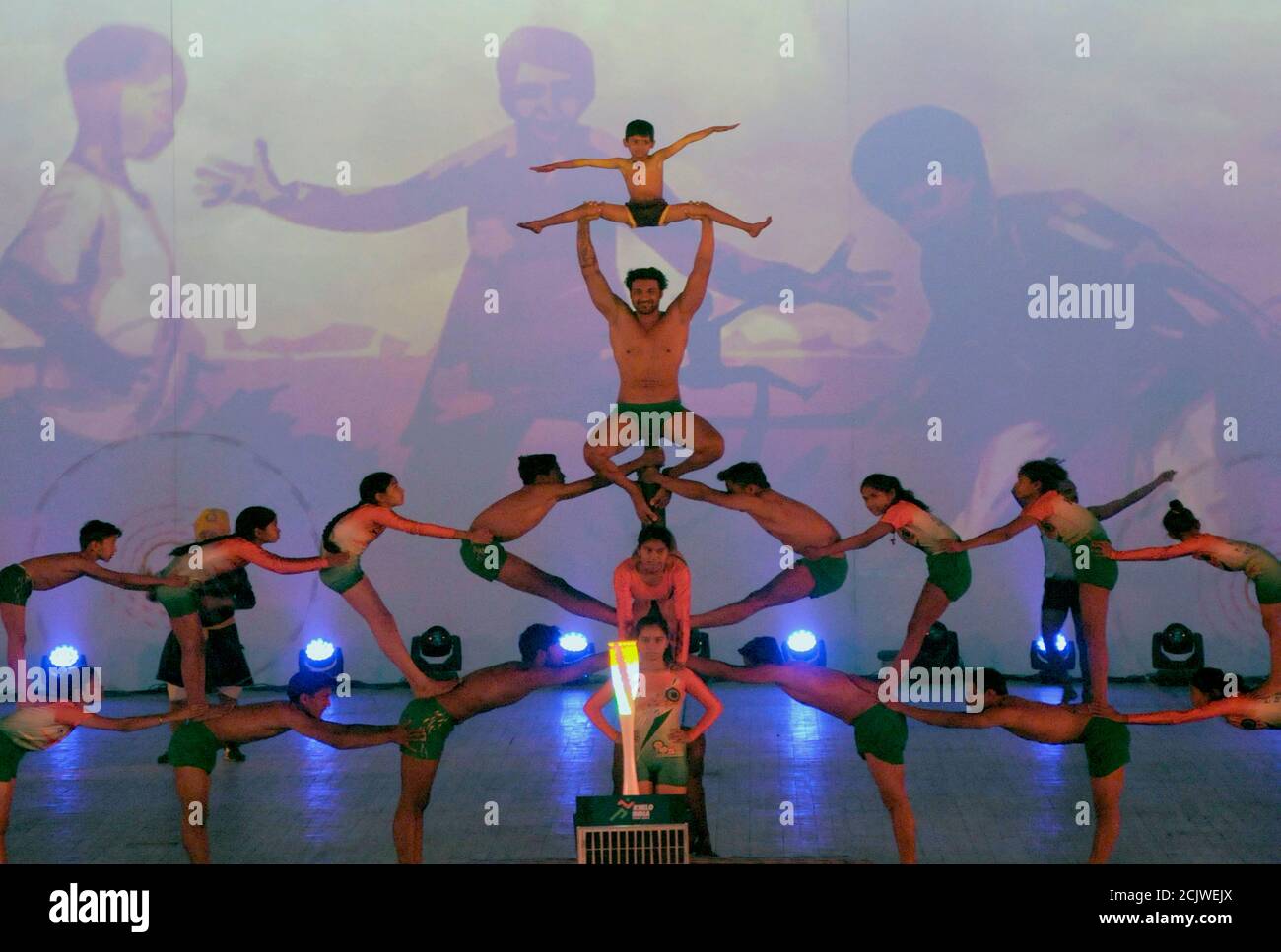 Students perform Acro dance in New Delhi. Acro dance is a style of dance that combines classical dance technique with precision acrobatic elements. De Stock Photo