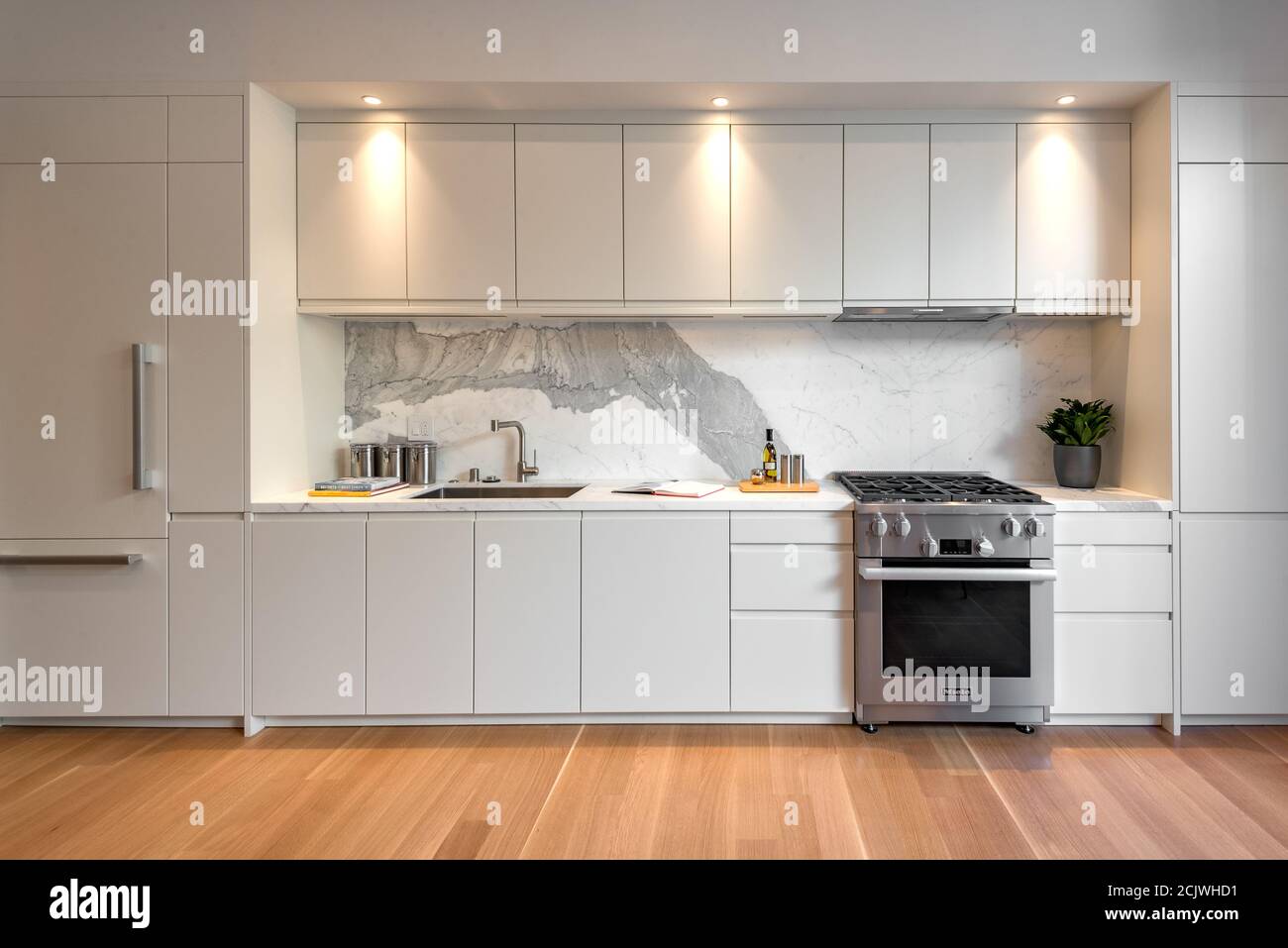 Interior of a modern kitchen with white furniture Stock Photo - Alamy