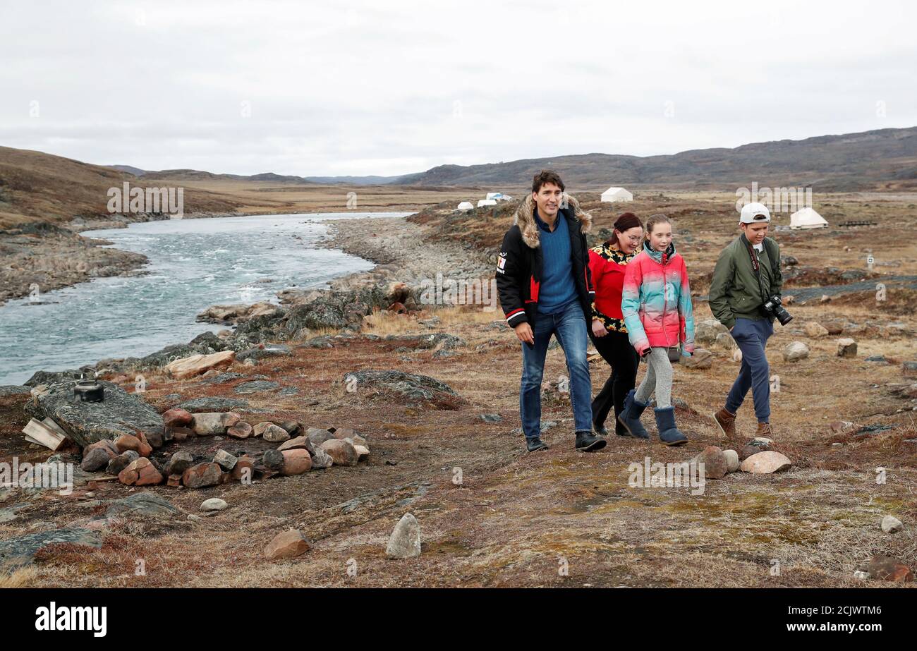 Liberal leader and Canadian Prime Minister Justin Trudeau, accompanied by his kids Ella-Grace Margaret and Xavier James and by Nunavut's Liberal candidate Megan Pizzo-Lyall, is seen during an election campaign visit to Iqaluit, Nunavut, Canada October 8, 2019. REUTERS/Stephane Mahe Stock Photo