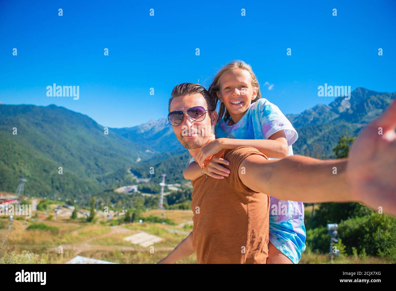 Beautiful happy family in mountains in the background Stock Photo - Alamy
