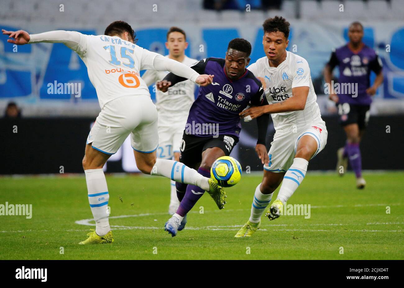 Soccer Football - Ligue 1 - Olympique de Marseille v Toulouse - Orange  Velodrome, Marseille, France - February 8, 2020 Toulouse's Aaron Leya Iseka  in action with Olympique de Marseille's Duje Caleta