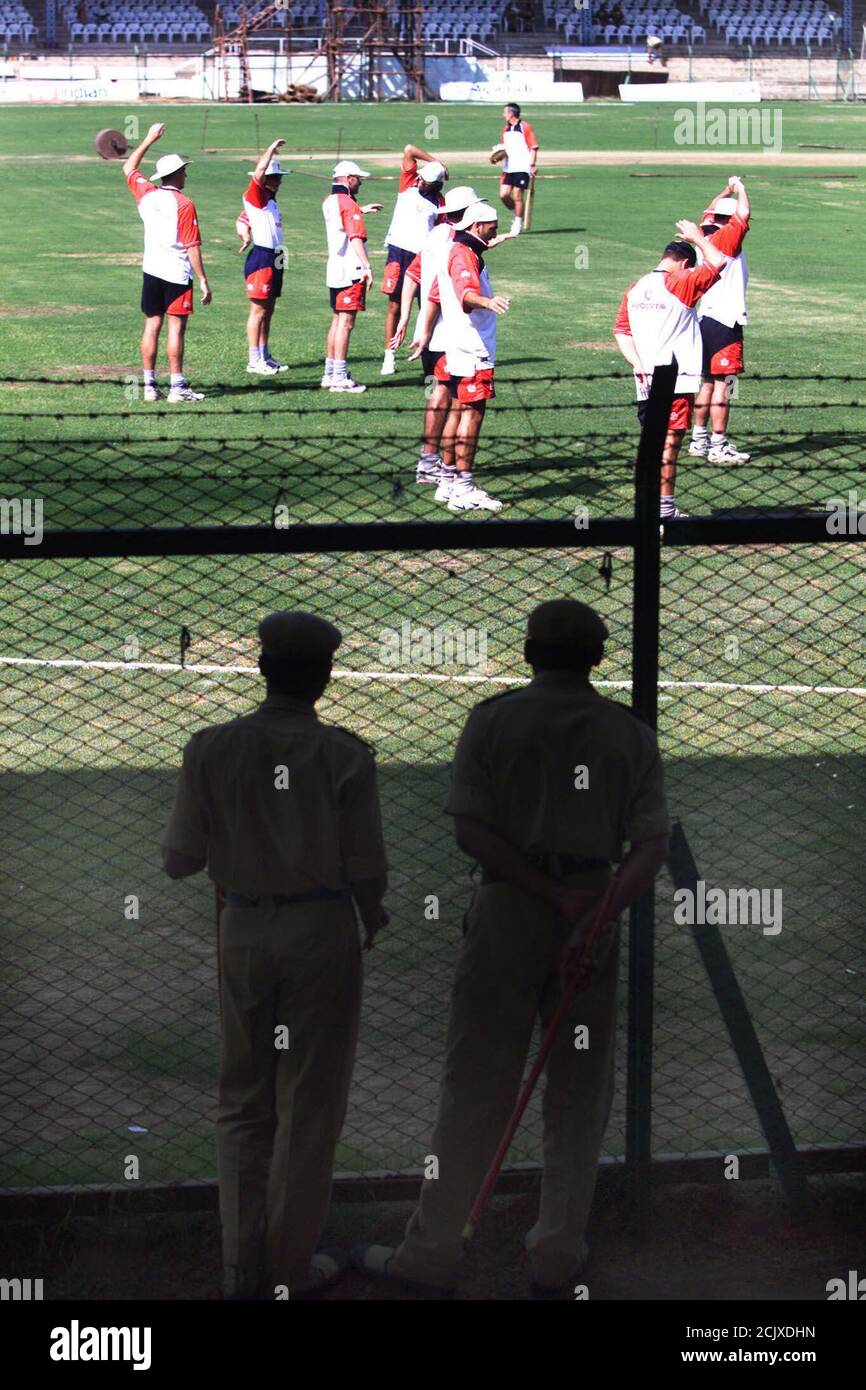 The England Cricket Team Are Watched By Police As They Warm Up Before Nets Practice In The Hyderabad Cricket Stadium Novemer 21 2001 England Start A Three Day Game Against A Board