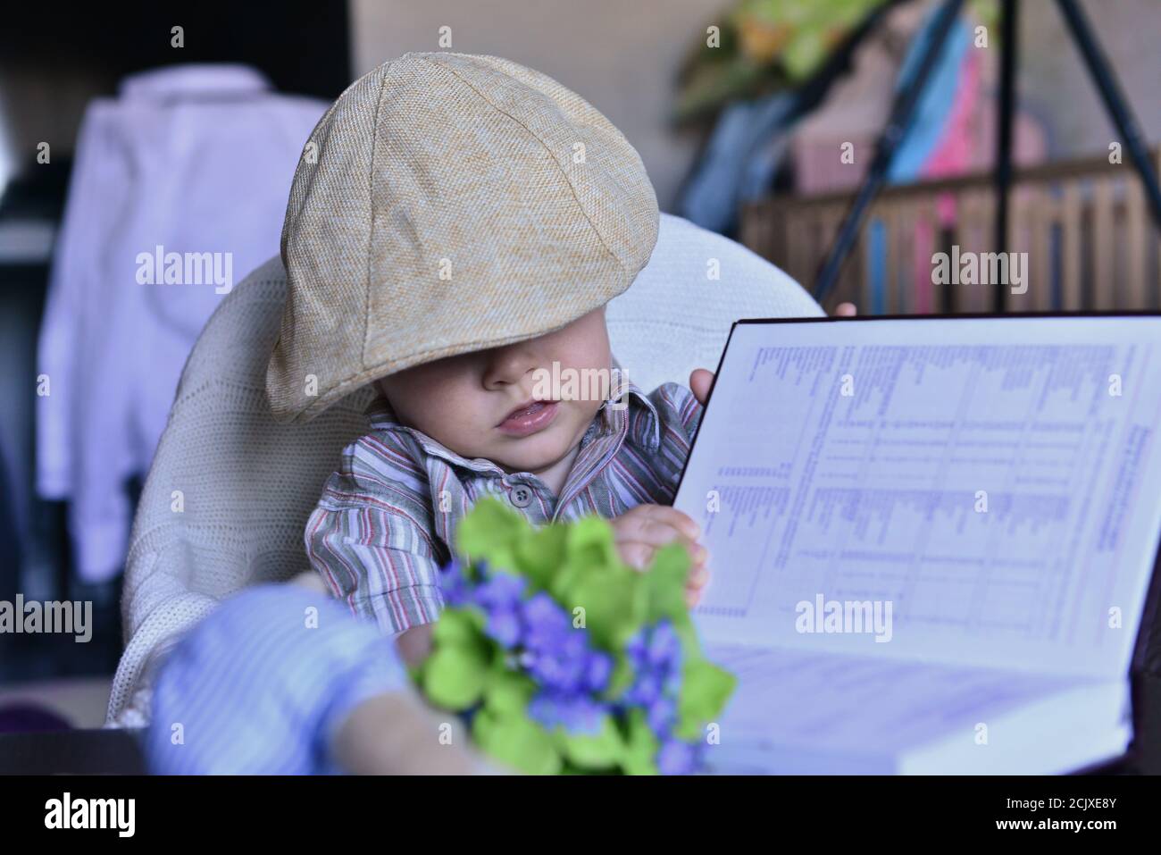 little boy is reading a book. Learning and learning science Stock Photo