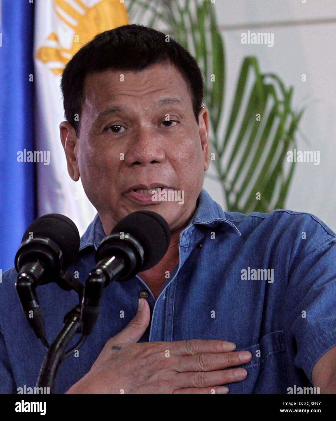 Philippines' President Rodrigo Duterte gestures while delivering a