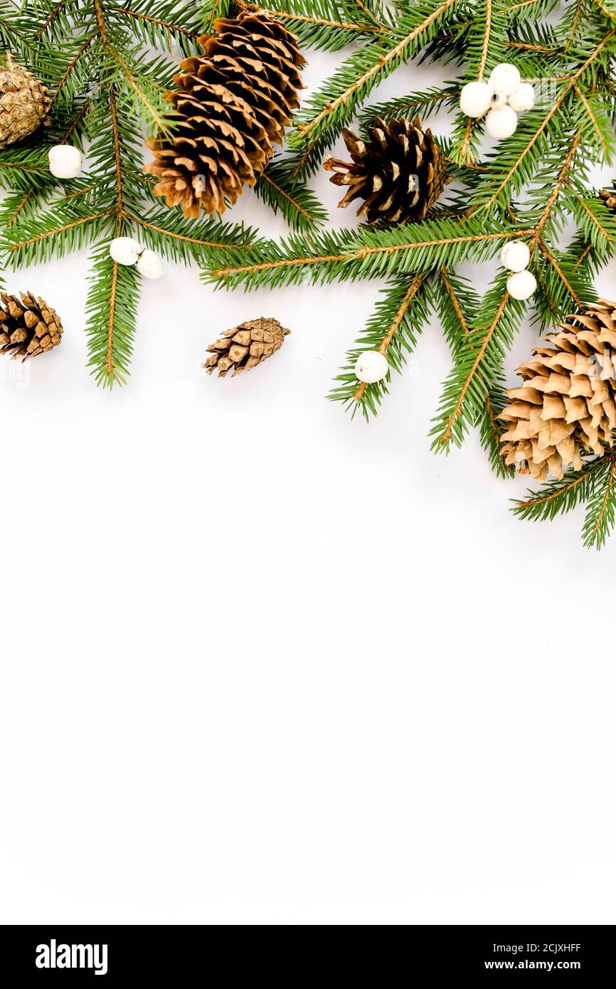 Christmas composition with fir branches, pine cones on white background ...