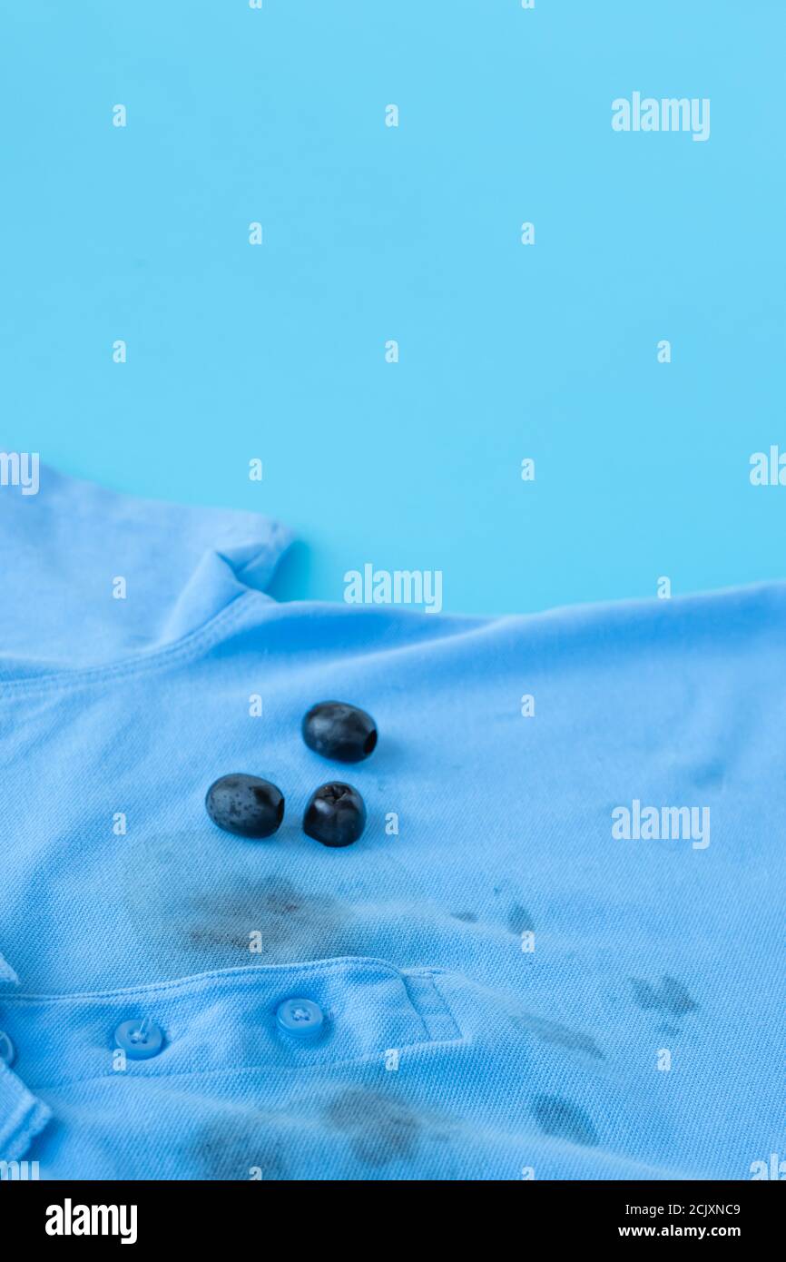 close up dirty stain of black olives on clothes. High quality photo Stock Photo