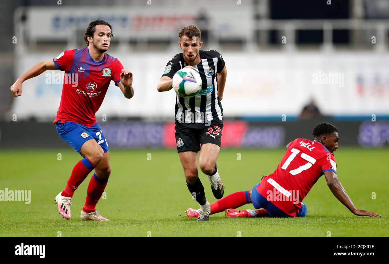 Blackburn Rovers' Lewis Travis (left), Newcastle United's Daniel Barlaser and Blackburn Rovers' Amari'i Bell (right) battle for the ball during the Carabao Cup match at St James' Park, Newcastle. Stock Photo