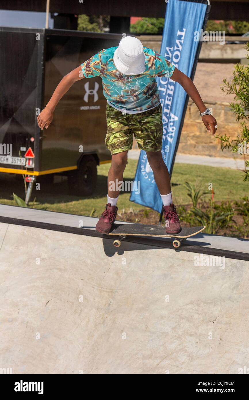 African teenager skating at Battery Park at the V&A Waterfront, Cape