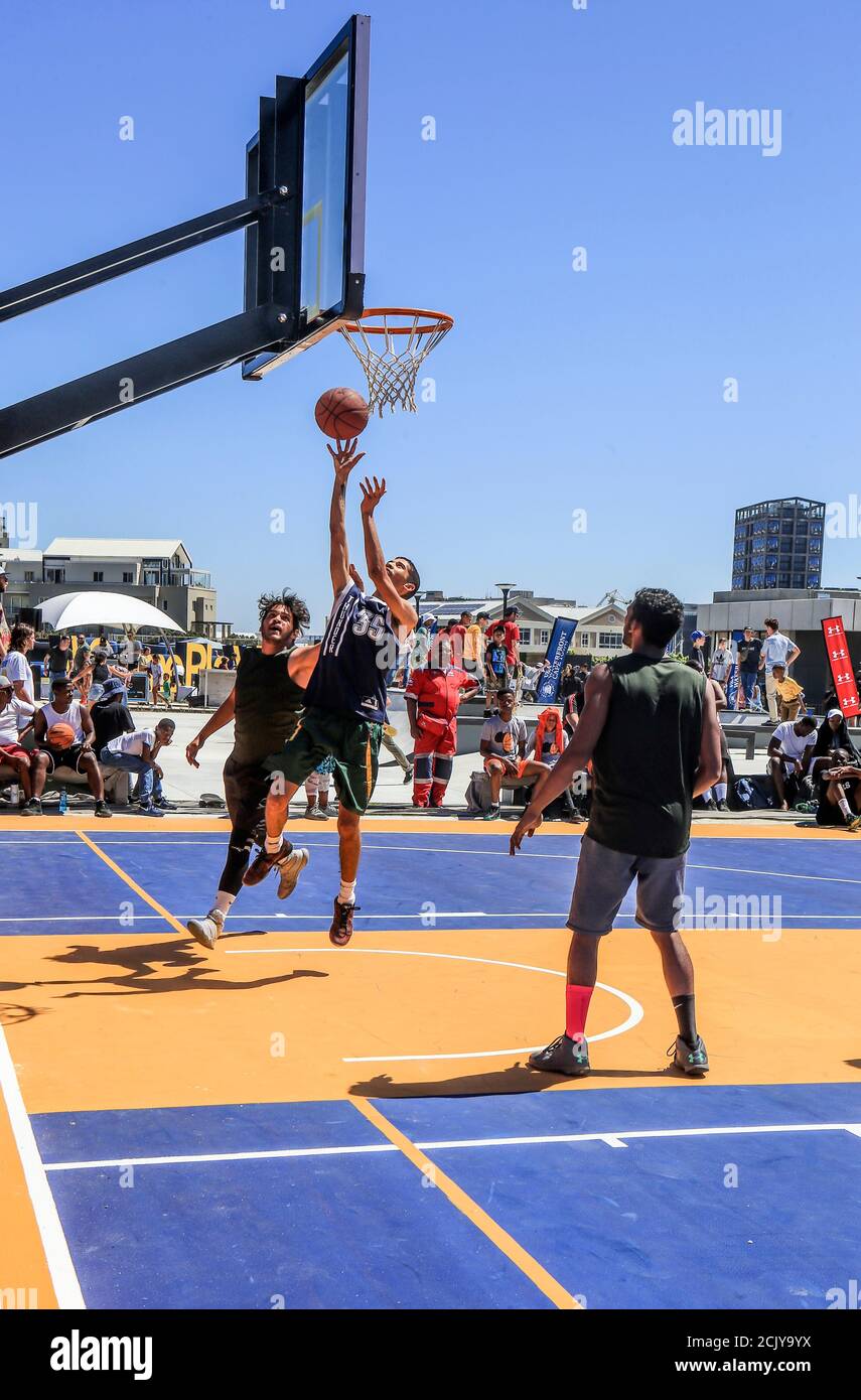 African teenagers playing basketball at Battery Park at the V&A