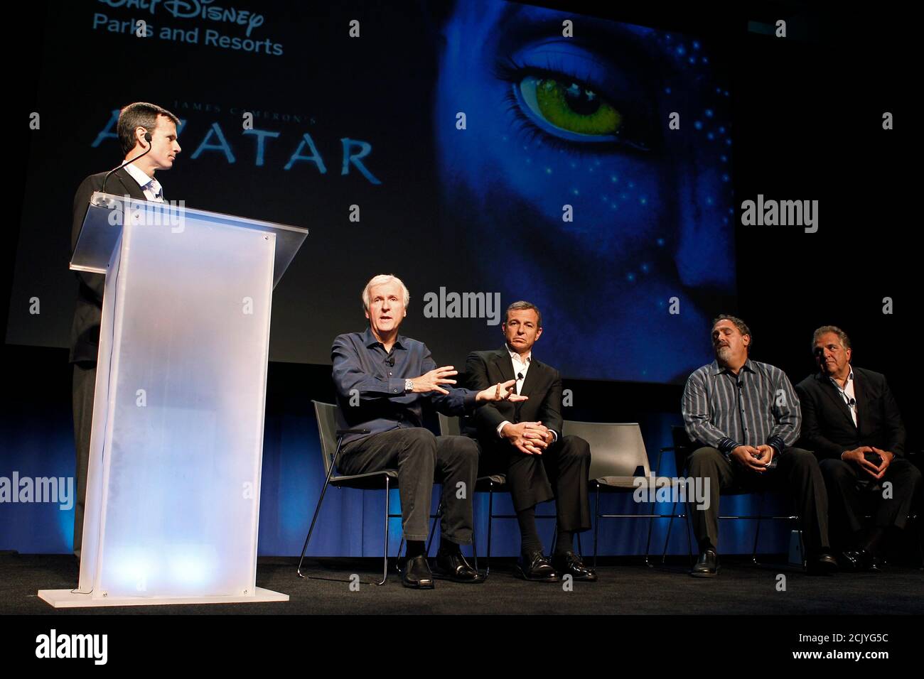 Thomas O Staggs Chairman Of Walt Disney Parks And Resorts Stands A Podium As L R Director James Cameron Robert A Iger President And Ceo Of The Walt Disney Co Avatar Producer Jon