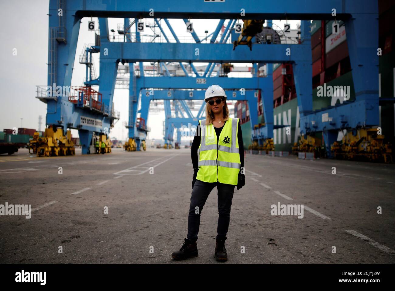 Liz Azoulay, 26, who loads and unloads cargo at Ashdod port, poses for a photograph at the port, in Ashdod, southern Israel, February 22, 2017. 'In most of my professional life I did not face any inequality. In the port of Ashdod we are equal on the docks. I am the first woman who began working at the Ashdod port as a stevedore.' REUTERS/Amir Cohen SEARCH 'WOMEN WORK' FOR THIS STORY. SEARCH 'WIDER IMAGE' FOR ALL STORIES. Stock Photo