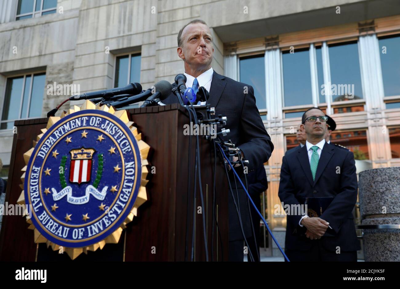 Special Agent in Charge of the FBI Washington Field Office, Timothy Slater  (L) and Assistant Director in Charge of the FBI Washington Field Office,  Andrew Vale (R) participate in a press conference