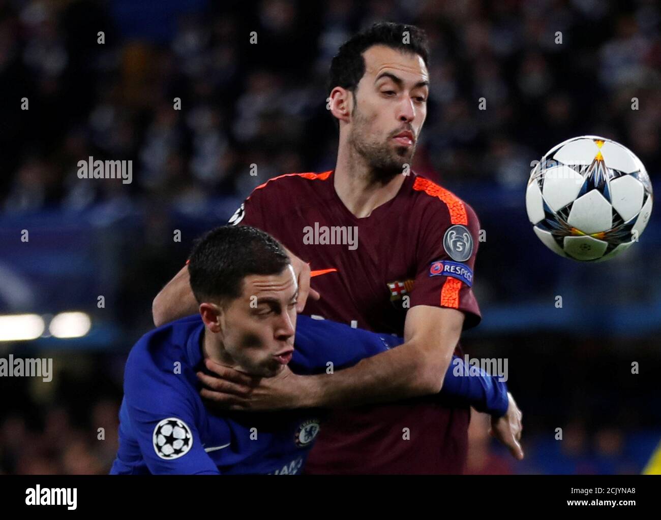 Soccer Football - Champions League Round of 16 First Leg - Chelsea vs FC Barcelona - Stamford Bridge, London, Britain - February 20, 2018   Chelsea's Eden Hazard in action with Barcelona’s Sergio Busquets    REUTERS/Eddie Keogh Stock Photo