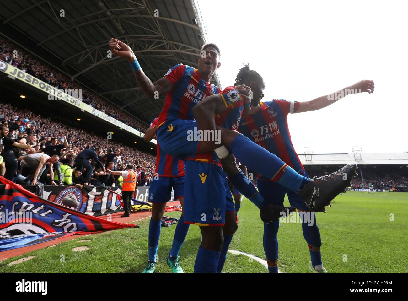 Soccer Football - Premier League - Crystal Palace vs West Bromwich Albion - Selhurst Park, London, Britain - May 13, 2018 Crystal Palace's Wilfried Zaha celebrates scoring their first goal with Patrick van Aanholt REUTERS/Hannah McKay EDITORIAL USE ONLY. No use with unauthorized audio, video, data, fixture lists, club/league logos or "live" services. Online in-match use limited to 75 images, no video emulation. No use in betting, games or single club/league/player publications. Please contact your account representative for further details. Stock Photo