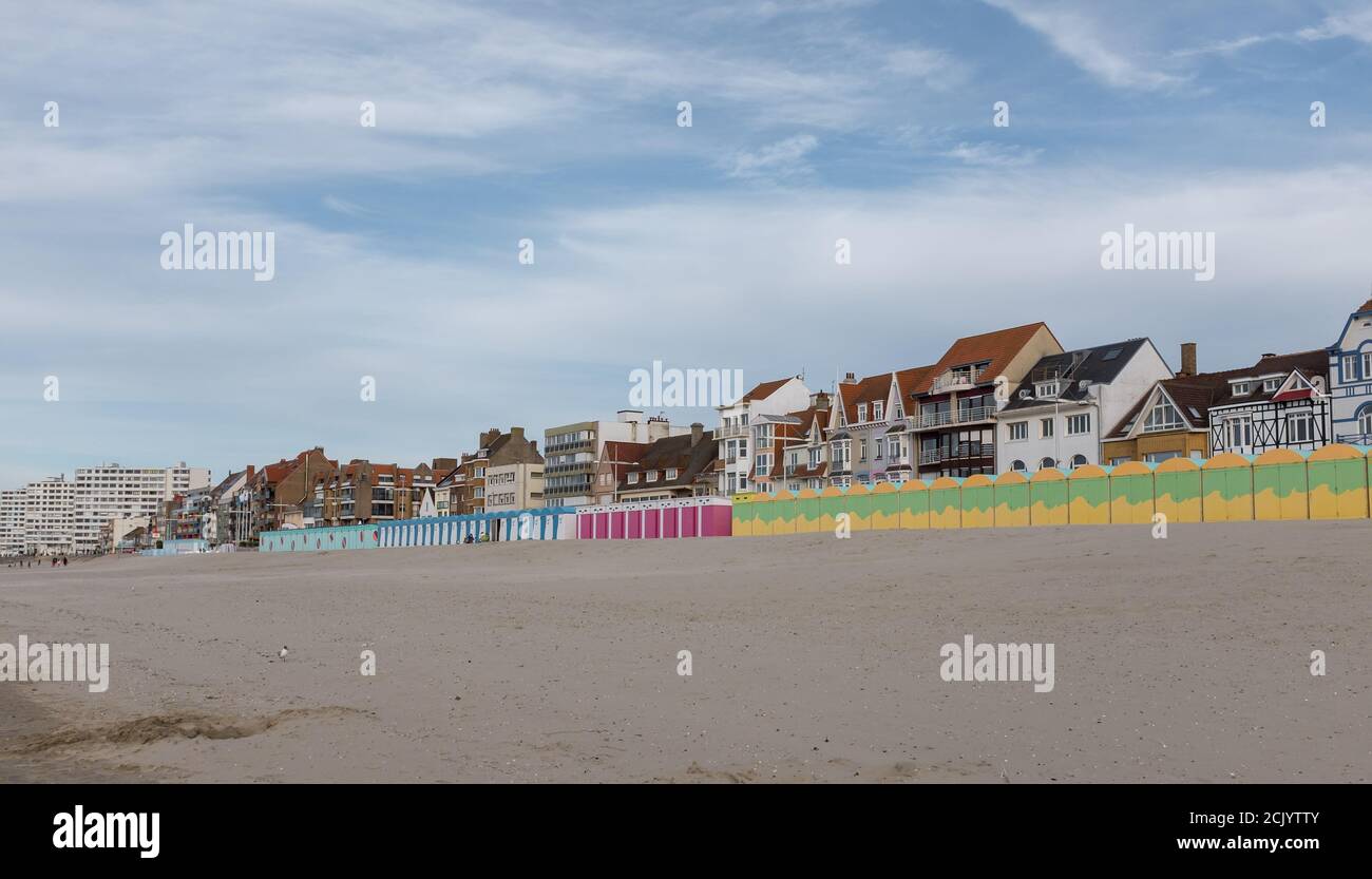 Colorful beach huts in front of historic seaside buildings in Dunkirk, France Stock Photo