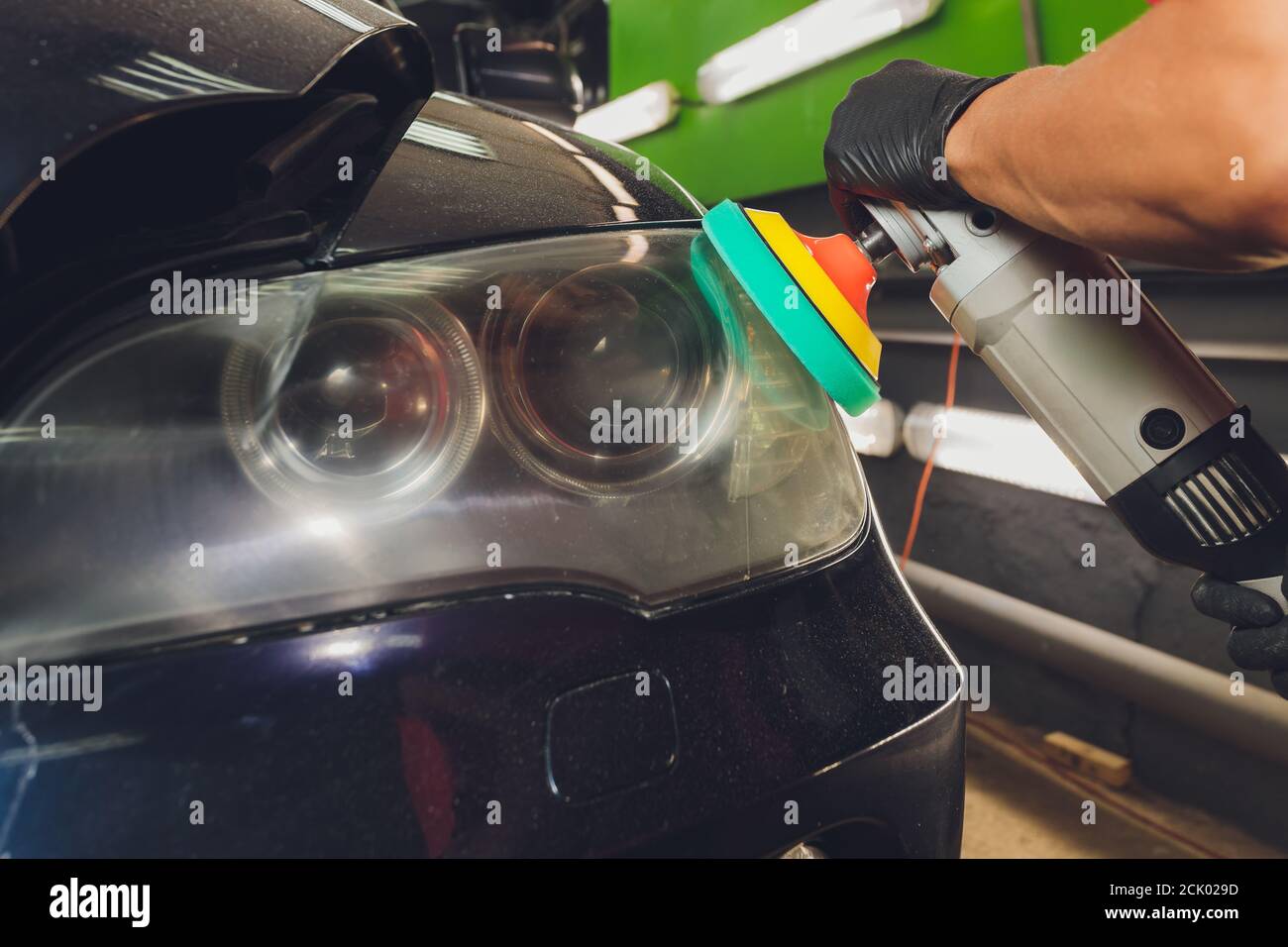 Car headlights cleaning with power buffer machine at car service Stock Photo Alamy