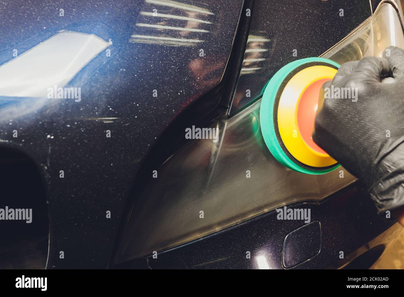 Car headlights cleaning with power buffer machine at car service Stock Photo Alamy