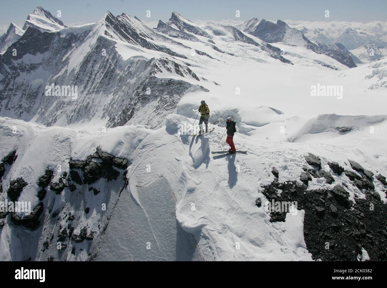 Telemark-Freerider Hannes Lipf of Germany (L) and Swiss freerider Sascha  Schmid stand on the top of the 3,970 m (2.46 miles) high Eiger mountain in  the Bernese Oberland in Switzerland, May 27,