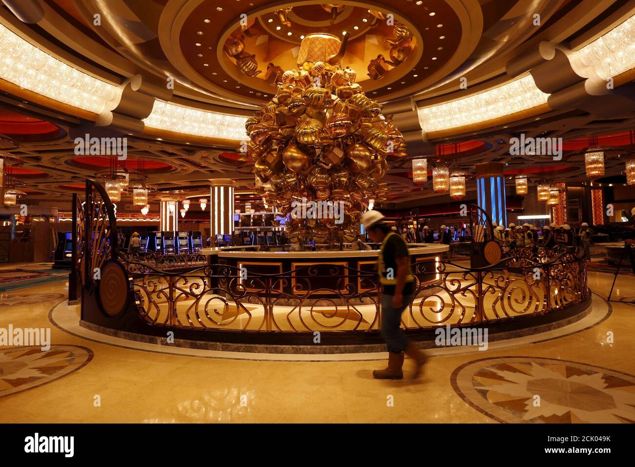 A construction worker walks inside a casino in Studio City, built ...