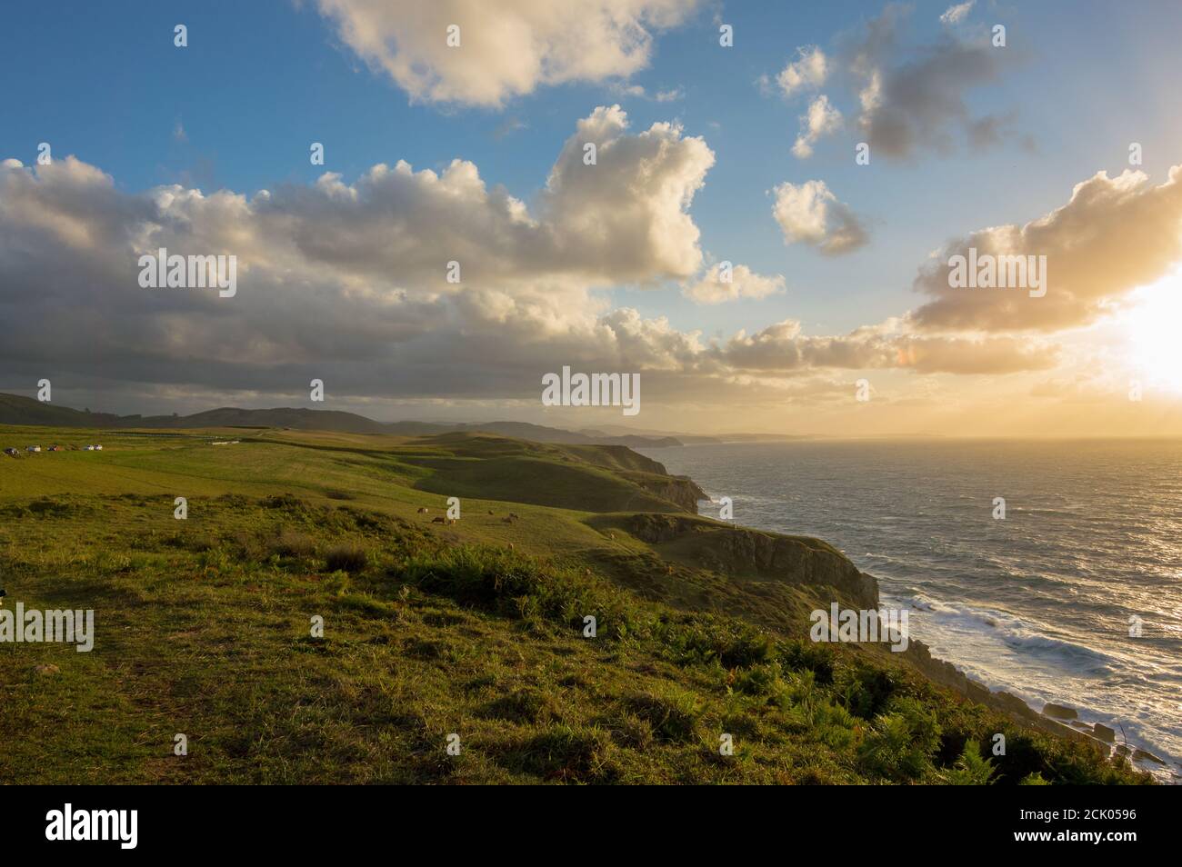 Beautiful scenery of rocky cliffs by the sea under a cloudy sky Stock ...
