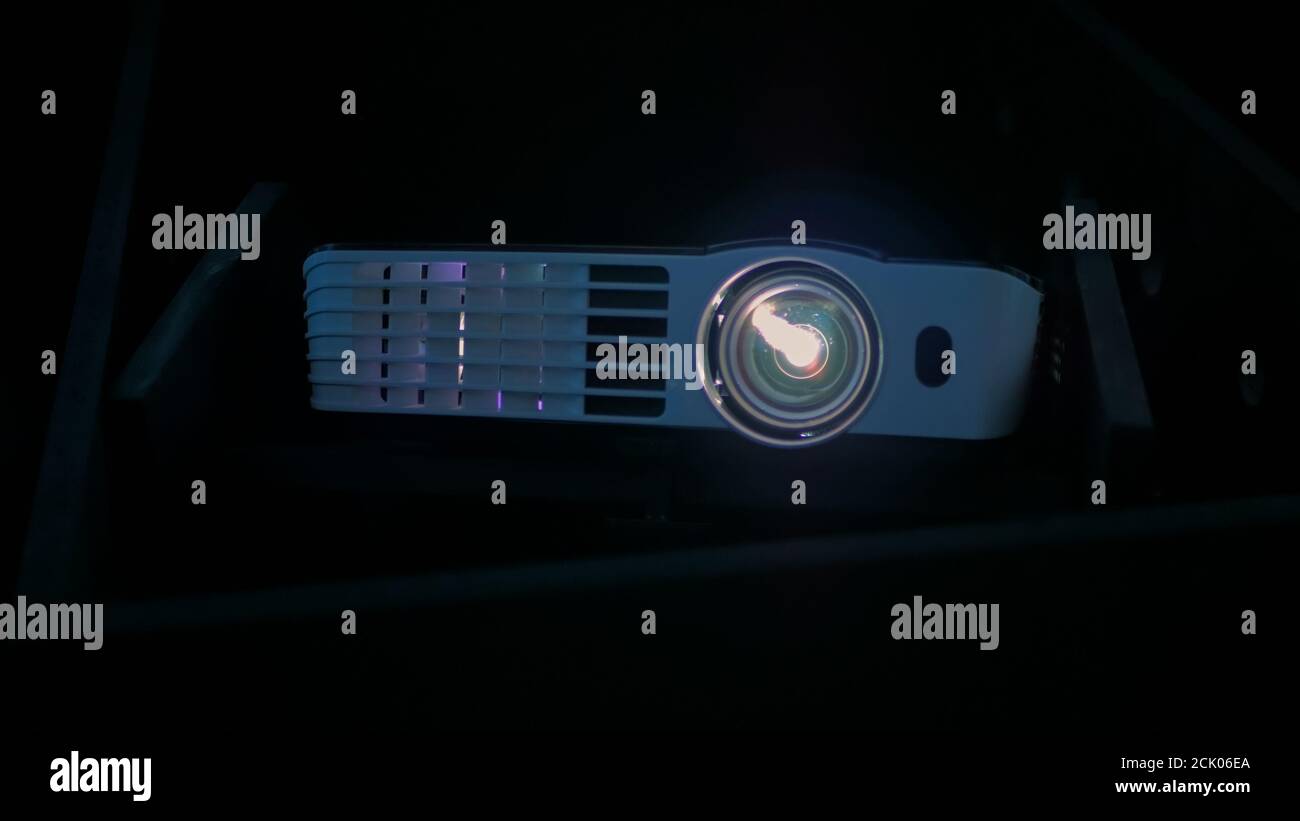 Front view of digital film projector in dark Stock Photo Alamy