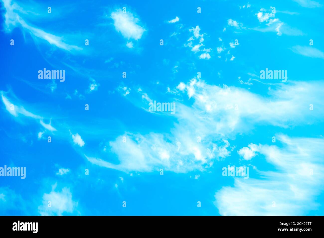 Blue sky background with white fluffy clouds Stock Photo