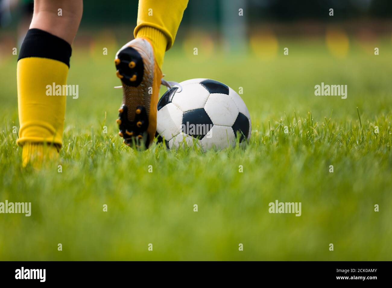 Closeup Of Soccer Player Running And Kicking Soccer Ball On Grass Lawn Legs Of Footballer Playing Competition Match Sports Horizontal Background At Stock Photo Alamy Closeup Of Soccer Player Running And Kicking Soccer Ball On Grass Lawn Legs Of Footballer Playing Competition Match Sports Horizontal Background At Stock Photo Alamy